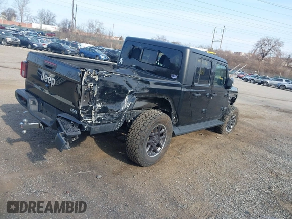 2021 Jeep Gladiator Overland z VIN 1C6HJTFG1ML606215, wystawiony jako IAAI lot #41771646 z przebiegiem 77 411 mil mil oraz . Historia ofert i sprzedaży dostępna na DreamBid. Obrazek 4.