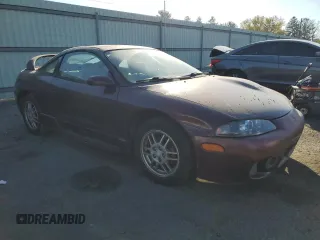 1999 Mitsubishi Eclipse with VIN 4A3AK44Y1XE074155, listed as a Copart auction lot 77143944 with 105,262 mi miles and Clean Title. Bid and sale history available at DreamBid. Image 4.