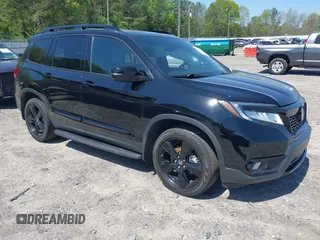 2019 Honda Passport Elite z VIN 5FNYF8H03KB003970, wystawiony jako IAAI lot #41974394 z przebiegiem 60 743 mil mil oraz . Historia ofert i sprzedaży dostępna na DreamBid. Obrazek 1.