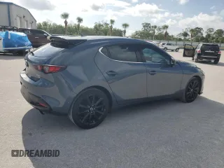 2021 Mazda 3 Premium Plus with VIN JM1BPBNYXM1403126, listed as a Copart auction lot 59971535 with 56,952 mi miles and Salvage title. Bid and sale history available at DreamBid. Image 3.