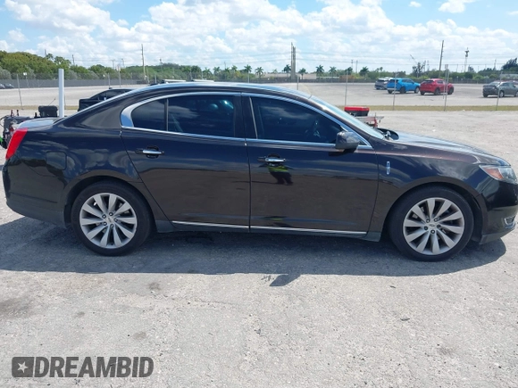 2014 Lincoln MKS with VIN 1LNHL9EK0EG608300, listed as a IAAI auction lot 41900902 with 144,253 mi miles. Bid and sale history available at carsss.com. Image 13.