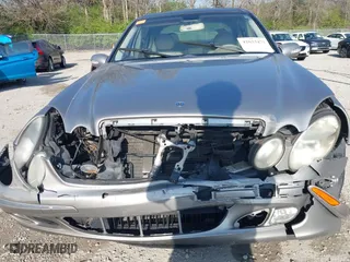 2003 Mercedes-Benz E-Class 3.2L with VIN WDBUF65J93X099223, listed as a IAAI auction lot 42033473 with 230,758 mi miles. Bid and sale history available at carsss.com. Image 6.