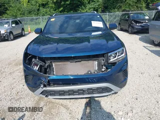 2022 Volkswagen Atlas SE z VIN 1V2HE2CA7NC211835, wystawiony jako IAAI lot #42722660 z przebiegiem 56 112 mil mil oraz . Historia ofert i sprzedaży dostępna na DreamBid. Obrazek 6.