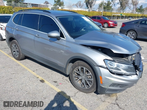 2021 Volkswagen Tiguan S with VIN 3VV1B7AX6MM131036, listed as a IAAI auction lot 41742604 with 55,155 mi miles and . Bid and sale history available at DreamBid. Image 1.