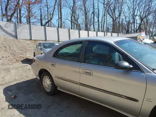 1999 Mercury Sable LS z VIN 1MEFM53S7XA622932, wystawiony jako IAAI lot #41708531 z przebiegiem 155 702 mil mil oraz . Historia ofert i sprzedaży dostępna na DreamBid. Obrazek 17.