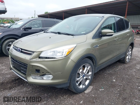 2013 Ford Escape SEL with VIN 1FMCU9H9XDUB61880, listed as a IAAI auction lot 42271136 with 115,837 mi miles and . Bid and sale history available at DreamBid. Image 2.