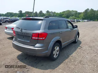 2013 Dodge Journey American Value z VIN 3C4PDCAB0DT691429, wystawiony jako IAAI lot #42514055 z przebiegiem 213 593 mil mil oraz . Historia ofert i sprzedaży dostępna na DreamBid. Obrazek 4.
