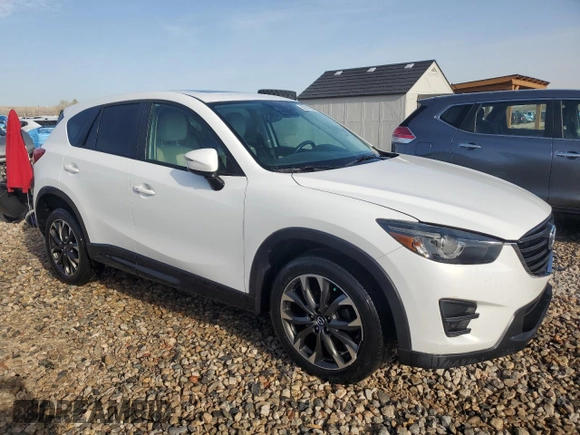 2016 Mazda CX-5 Grand Touring with VIN JM3KE4DY3G0688286, listed as a Copart auction lot 52182205 with 194,352 mi miles and Salvage Title. Bid and sale history available at DreamBid. Image 4.