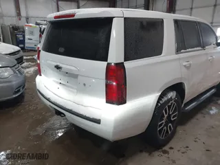 2015 Chevrolet Tahoe Commercial with VIN 1GNSK2EC8FR722684, listed as a IAAI auction lot 41553558 with 119,434 mi miles. Bid and sale history available at carsss.com. Image 4.