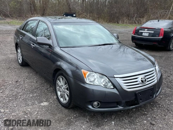 2010 Toyota Avalon XL with VIN 4T1BK3DB5AU353288, listed as a Copart auction lot 56857935 with 233,775 mi miles and Clean Title. Bid and sale history available at DreamBid. Image 1.