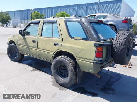 1995 Isuzu Rodeo z VIN 4S2CK58E5S4379419, wystawiony jako IAAI lot #42094055 z przebiegiem 196 175 mil mil oraz . Historia ofert i sprzedaży dostępna na DreamBid. Obrazek 3.