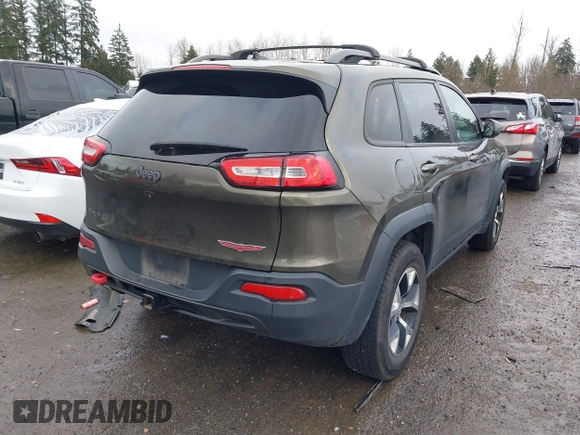 2015 Jeep Cherokee Trailhawk with VIN 1C4PJMBB5FW510514, listed as a IAAI auction lot 41492111 with 98,482 mi miles and . Bid and sale history available at DreamBid. Image 4.
