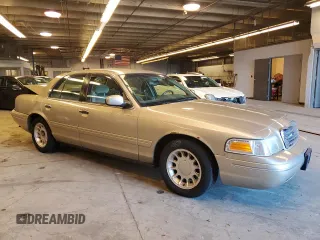 2000 Ford Crown Victoria LX z VIN 2FAFP74WXYX116130, wystawiony jako Copart lot #79441204 z przebiegiem 128 133 mil mil oraz Szkoda całkowita • Salvage title. Historia ofert i sprzedaży dostępna na DreamBid. Obrazek 4.