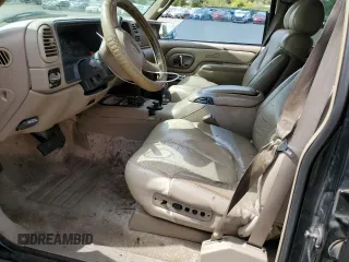 1999 GMC Denali z VIN 1GKEK13R1XR917376, wystawiony jako Copart lot #64991924 z przebiegiem 247 231 mil mil oraz Tytuł czysty. Historia ofert i sprzedaży dostępna na DreamBid. Obrazek 7.