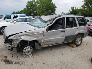 1996 Jeep Grand Cherokee Laredo with VIN 1J4GZ58S2TC401845, listed as a Copart auction lot 61013044 with 0 mi miles and Salvage Title. Bid and sale history available at carsss.com. Image 1.