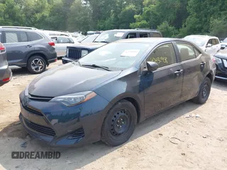2018 Toyota Corolla L with VIN 2T1BURHE1JC052651, listed as a IAAI auction lot 42430958 with 104,664 mi miles and . Bid and sale history available at DreamBid. Image 2.