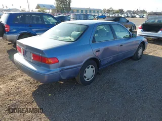 2000 Toyota Camry CE with VIN 4T1BG22K6YU000857, listed as a IAAI auction lot 42118645 with 244,448 mi miles and . Bid and sale history available at carsss.com. Image 4.