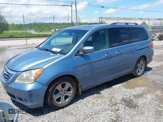 2010 Honda Odyssey Touring with VIN 5FNRL3H93AB058240, listed as a IAAI auction lot 42211192 with 223,859 mi miles and . Bid and sale history available at DreamBid. Image 2.