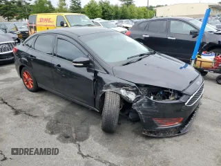 2016 Ford Focus SE with VIN 1FADP3F20GL303902, listed as a Copart auction lot 61374325 with 149,265 mi miles and Salvage title. Bid and sale history available at DreamBid. Image 4.