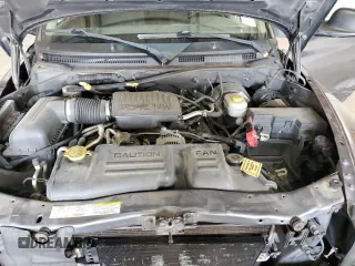 2004 Dodge Dakota Sport z VIN 1D7HL38N54S536938, wystawiony jako Copart lot #52455345 z przebiegiem 157 791 mil mil oraz Szkody całkowita. Historia ofert i sprzedaży dostępna na DreamBid. Obrazek 11.