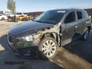 2014 Mazda CX-5 Grand Touring with VIN JM3KE4DY1E0328852, listed as a Copart auction lot 53965265 with 67,242 mi miles and Salvage Title. Bid and sale history available at DreamBid. Image 1.