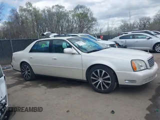 2003 Cadillac DeVille z VIN 1G6KD54Y13U208351, wystawiony jako IAAI lot #41889713 z przebiegiem 132 774 mil mil oraz . Historia ofert i sprzedaży dostępna na DreamBid. Obrazek 14.