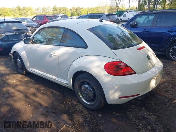 2012 Volkswagen Beetle 2.5L w/Sound/Nav PZEV with VIN 3VWJP7AT1CM619318, listed as a IAAI auction lot 42223291 with 85,989 mi miles and . Bid and sale history available at DreamBid. Image 3.