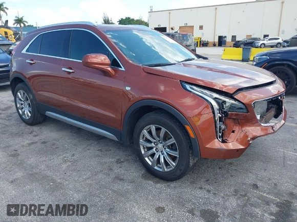 2019 Cadillac XT4 FWD Premium Luxury z VIN 1GYFZCR41KF183507, wystawiony jako IAAI lot #41987176 z przebiegiem 64 803 mil mil oraz . Historia ofert i sprzedaży dostępna na DreamBid. Obrazek 1.