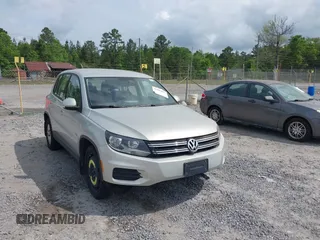 2014 Volkswagen Tiguan SE with VIN WVGBV3AX7EW619427, listed as a IAAI auction lot 42100055 with 126,110 mi miles and . Bid and sale history available at DreamBid. Image 1.