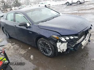 2021 Toyota Avalon Hybrid XSE z VIN 4T1EA1AB9MU003563, wystawiony jako IAAI lot #41560719 z przebiegiem 105 300 mil mil oraz . Historia ofert i sprzedaży dostępna na DreamBid. Obrazek 1.