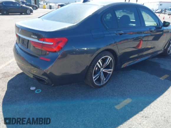 2016 BMW 7 Series 740i with VIN WBA7E2C52GG548048, listed as a IAAI auction lot 41701806 with 72,680 mi miles. Bid and sale history available at carsss.com. Image 4.