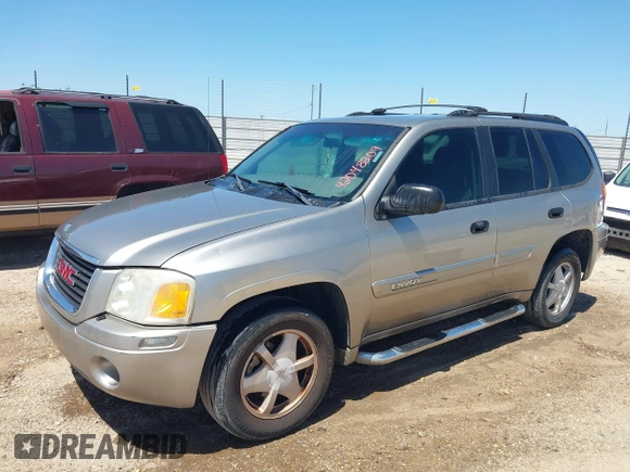 2003 GMC Envoy SLT with VIN 1GKDS13S732150215, listed as a IAAI auction lot 42048209 with 329,719 mi miles. Bid and sale history available at carsss.com. Image 2.