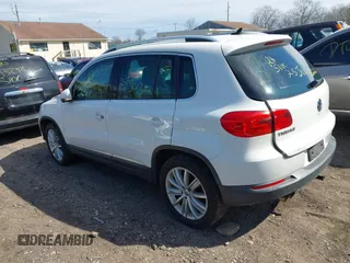 2012 Volkswagen Tiguan S with VIN WVGBV7AX0CW582922, listed as a IAAI auction lot 41906974 with 150,681 mi miles and . Bid and sale history available at DreamBid. Image 3.