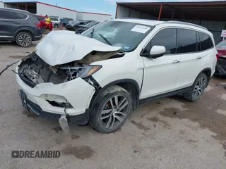 2017 Honda Pilot Touring with VIN 5FNYF6H9XHB034001, listed as a IAAI auction lot 42092549 with 142,422 mi miles and . Bid and sale history available at DreamBid. Image 2.