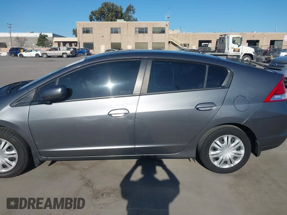 2010 Honda Insight LX with VIN JHMZE2H50AS019740, listed as a IAAI auction lot 41665527 with 74,022 mi miles and . Bid and sale history available at DreamBid. Image 14.