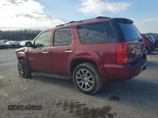 2009 GMC Yukon SLT w/4SA with VIN 1GKFK330X9R207168, listed as a Copart auction lot 85997244 with 123,227 mi miles and Salvage Title. Bid and sale history available at carsss.com. Image 2.