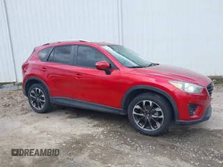2016 Mazda CX-5 Grand Touring z VIN JM3KE2DY6G0693678, wystawiony jako IAAI lot #42443247 z przebiegiem 127 620 mil mil oraz . Historia ofert i sprzedaży dostępna na DreamBid. Obrazek 13.