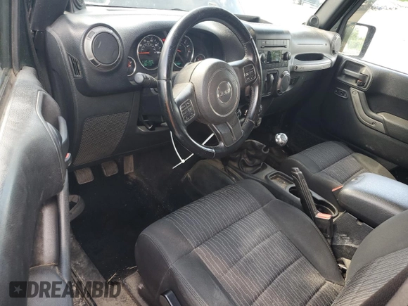 2012 Jeep Wrangler Sport with VIN 1C4AJWAG6CL256792, listed as a Copart auction lot 62634515 with 137,507 mi miles and Salvage title. Bid and sale history available at DreamBid. Image 8.