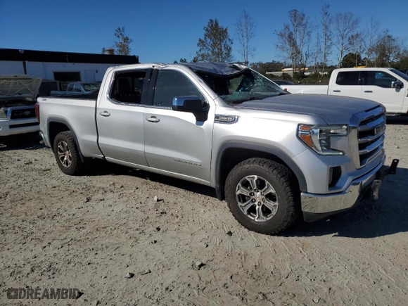 2021 GMC Sierra 1500 SLE with VIN 3GTU9BED0MG123068, listed as a Copart auction lot 76263784 with 123,656 mi miles and Salvage Title. Bid and sale history available at carsss.com. Image 4.