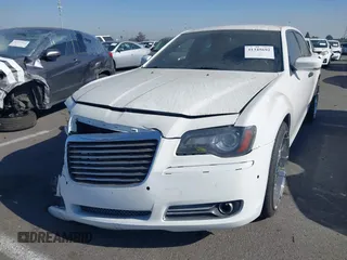 2014 Chrysler 300 S with VIN 2C3CCABG0EH235784, listed as a IAAI auction lot 41345692 with 109,920 mi miles and . Bid and sale history available at DreamBid. Image 2.