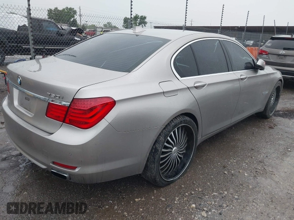 2012 BMW 7 Series 750i with VIN WBAKA8C50CDX01319, listed as a IAAI auction lot 42133359 with 168,986 mi miles and . Bid and sale history available at DreamBid. Image 4.