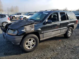 1999 Jeep Grand Cherokee Laredo with VIN 1J4GW58N1XC737706, listed as a Copart auction lot 83107914 with Not provided miles and Salvage title. Bid and sale history available at DreamBid. Image 1.