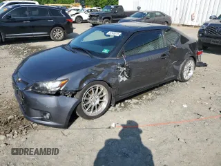 2012 Scion tC z VIN JTKJF5C71C3026515, wystawiony jako Copart lot #59348015 z przebiegiem 88 153 mil mil oraz Szkoda całkowita • Salvage title. Historia ofert i sprzedaży dostępna na DreamBid. Obrazek 1.