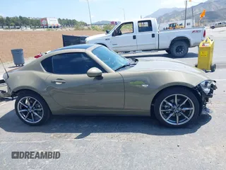 2023 Mazda MX-5 Miata Grand Touring z VIN JM1NDAM73P0561844, wystawiony jako IAAI lot #42195198 z przebiegiem 6 020 mil mil oraz . Historia ofert i sprzedaży dostępna na DreamBid. Obrazek 14.