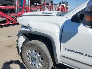 2019 GMC Sierra 2500HD Denali with VIN 1GT12SEY8KF139611, listed as a IAAI auction lot 41641028 with 69,776 mi miles. Bid and sale history available at carsss.com. Image 6.