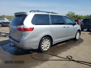2015 Toyota Sienna Limited with VIN 5TDDK3DCXFS114708, listed as a Copart auction lot 55411465 with Not Provided miles and Salvage Title. Bid and sale history available at DreamBid. Image 3.