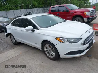 2018 Ford Fusion SE z VIN 3FA6P0LU6JR173193, wystawiony jako IAAI lot #42336594 z przebiegiem 198 571 mil mil oraz . Historia ofert i sprzedaży dostępna na DreamBid. Obrazek 1.