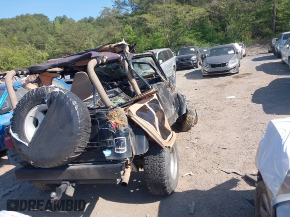 1999 Jeep Wrangler Sahara with VIN 1J4FY49S2XP466068, listed as a IAAI auction lot 42062789 with Not provided miles and . Bid and sale history available at DreamBid. Image 4.