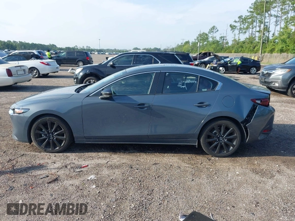 2024 Mazda 3 S Carbon Edition with VIN 3MZBPBCM6RM411828, listed as a IAAI auction lot 42802141 with 40,061 mi miles and . Bid and sale history available at DreamBid. Image 14.