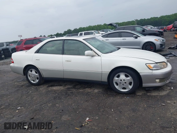 2001 Lexus ES 300 z VIN JT8BF28G410307451, wystawiony jako IAAI lot #42369871 z przebiegiem 290 620 mil mil oraz . Historia ofert i sprzedaży dostępna na DreamBid. Obrazek 13.